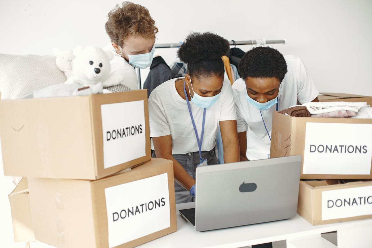 Community organization team preparing donation boxes