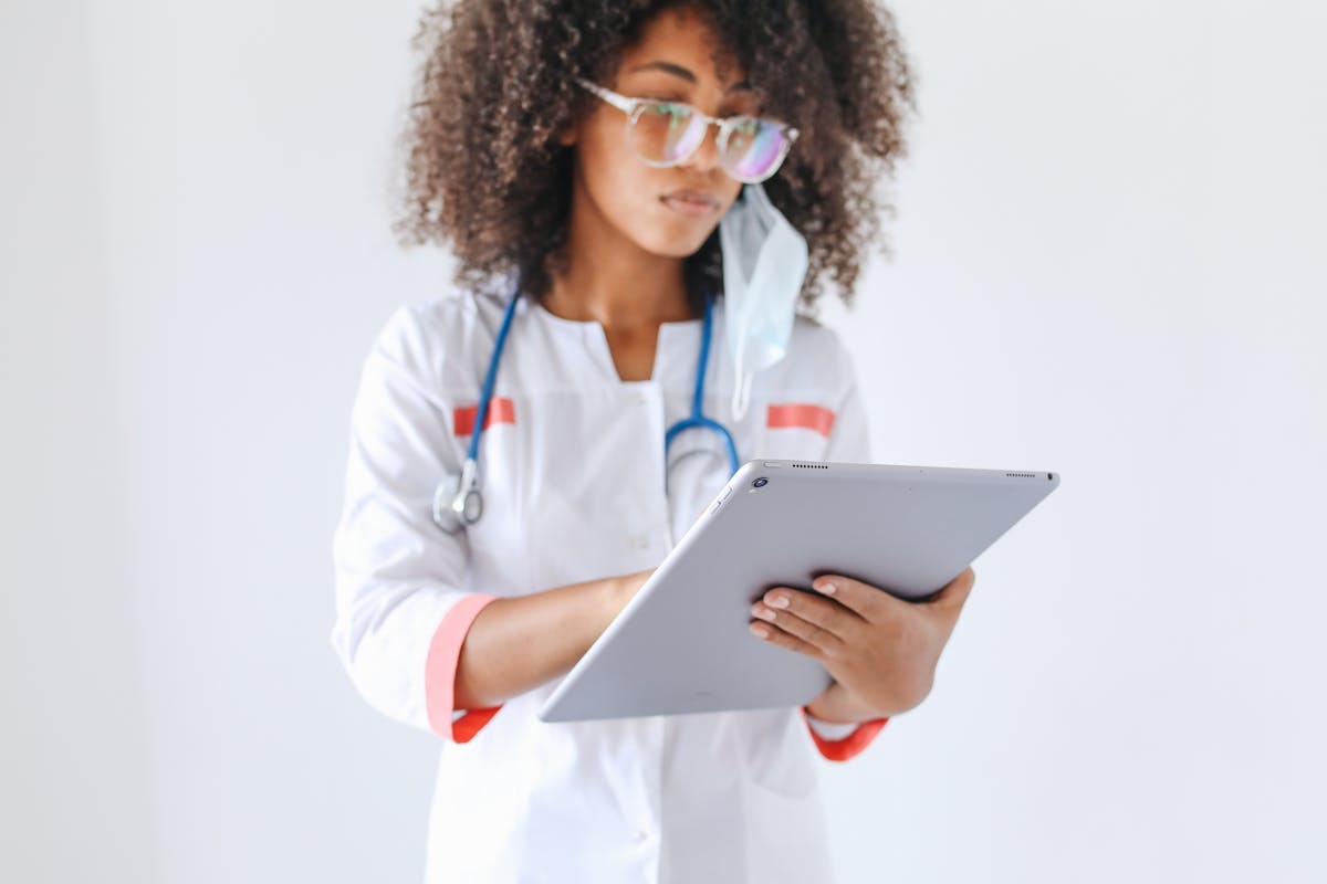 Healthcare professional using a tablet