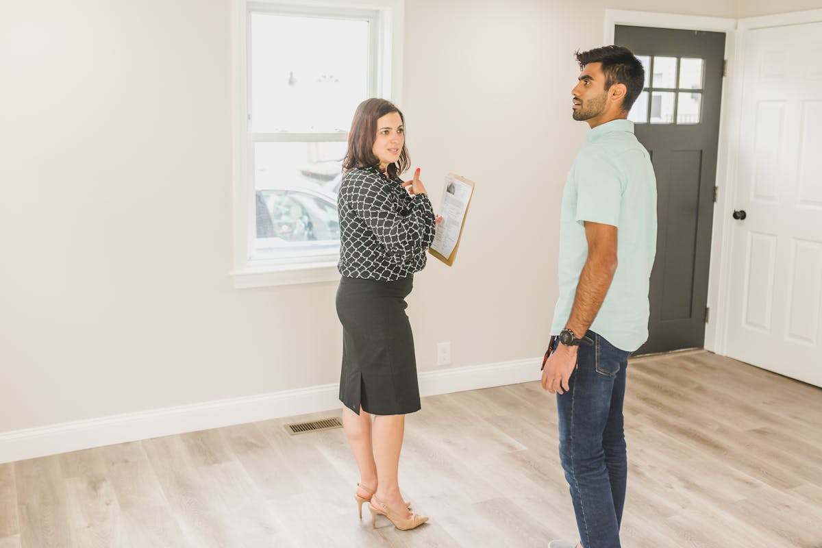 Real estate agent showing a home to a client