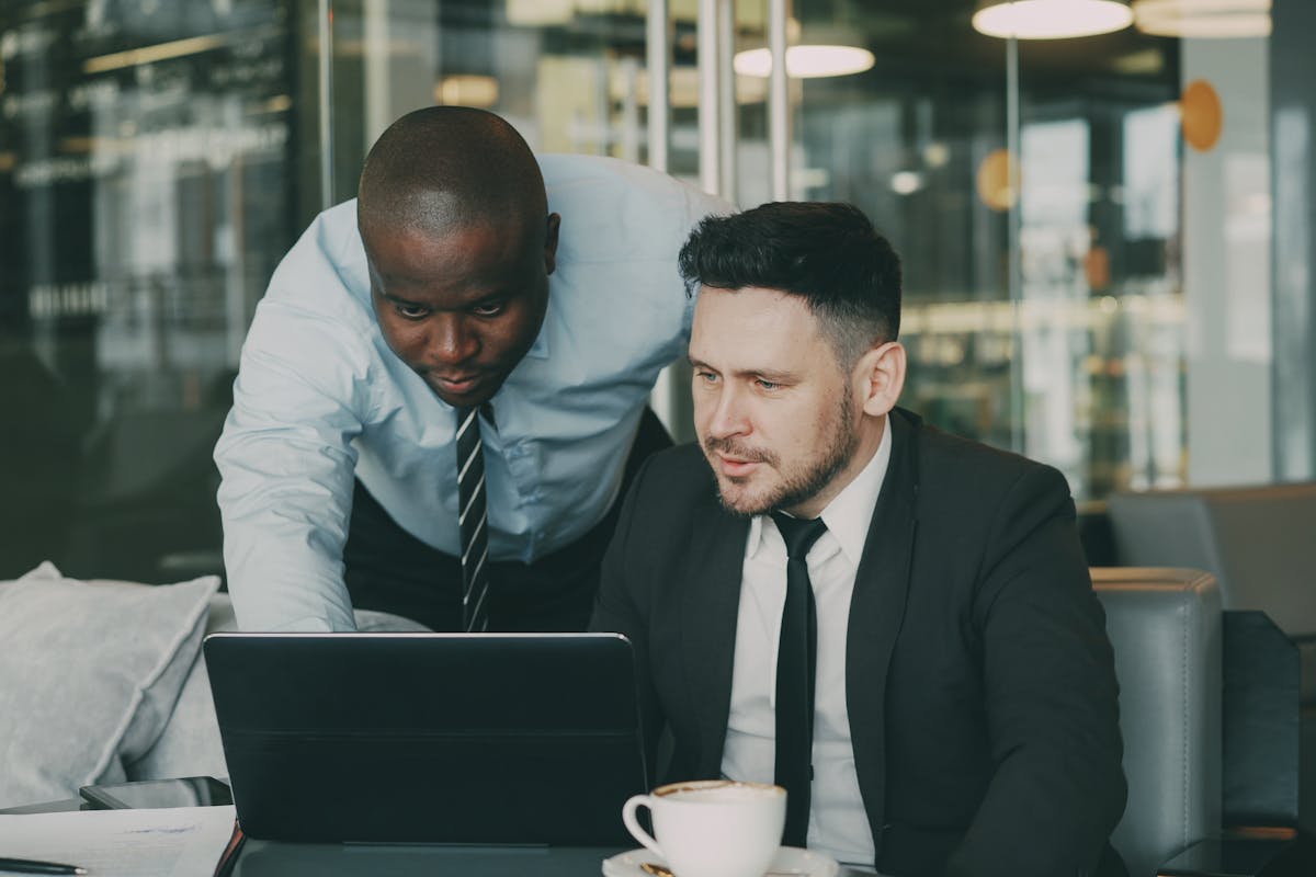 Business consultants reviewing a laptop together